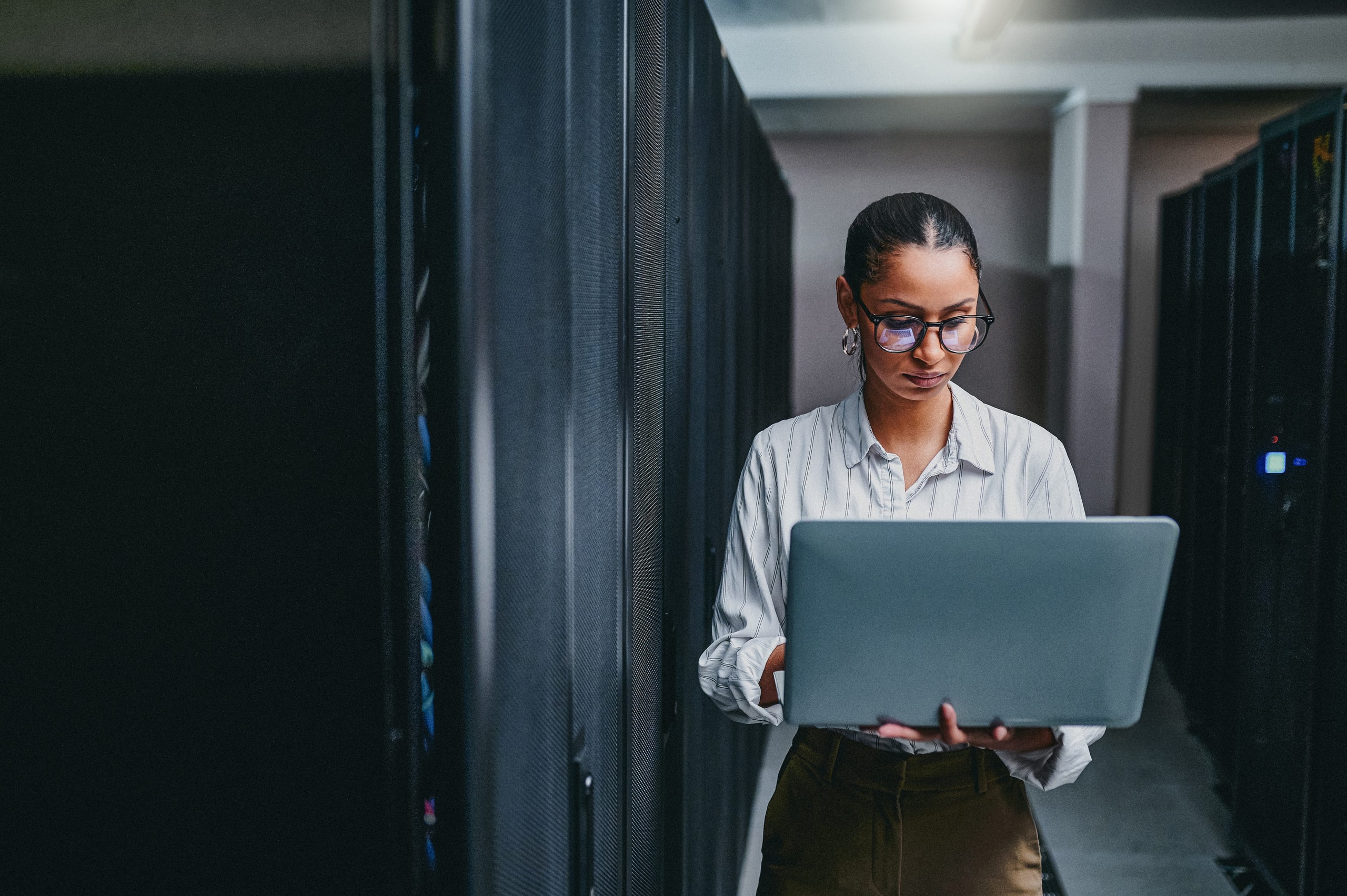 Technician working in a data hall.
