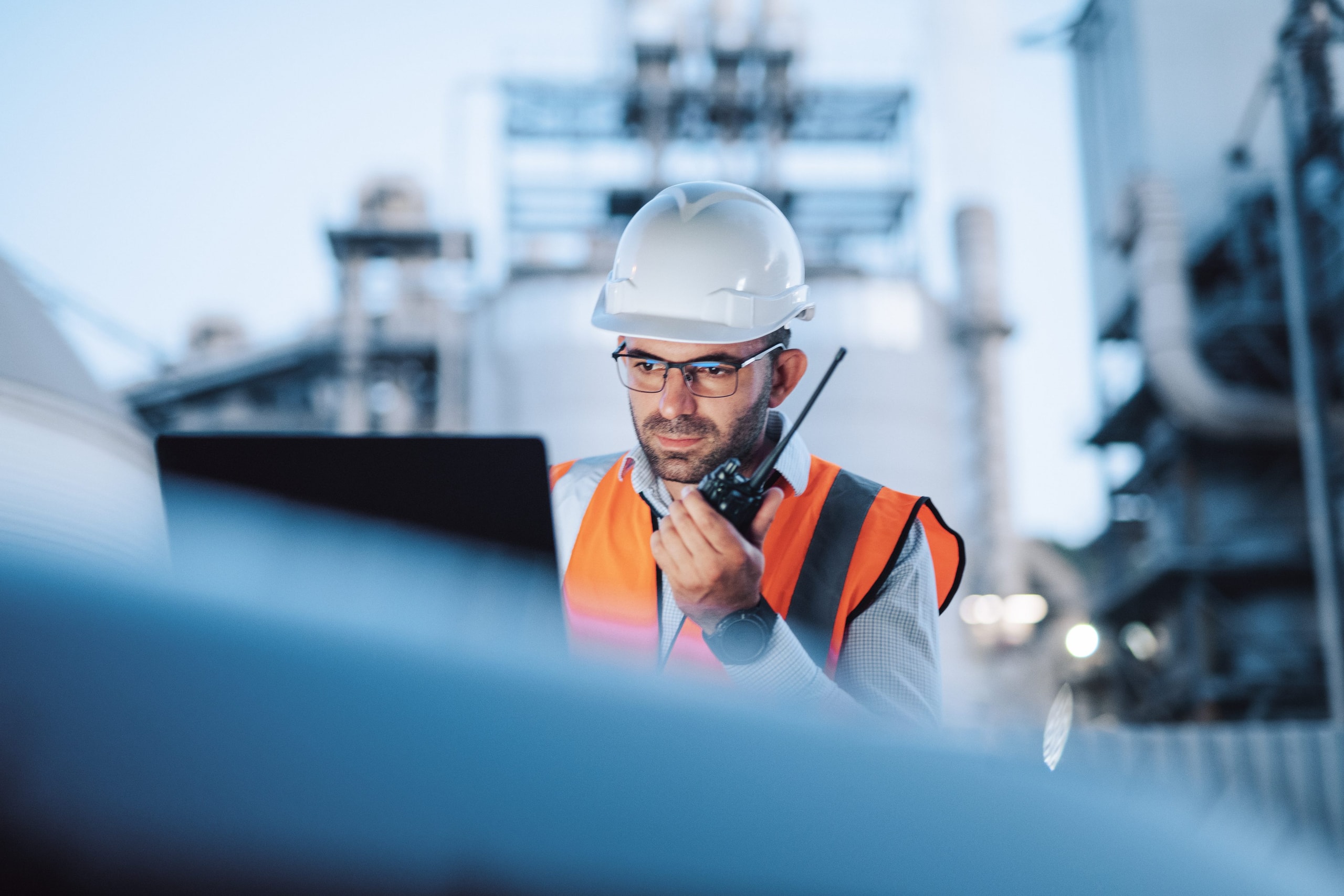 Engineer monitoring systems on a night shift.